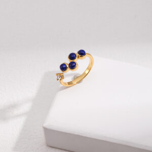 Gold-plated earrings with lapis lazuli stones, inspired by planetary orbits.