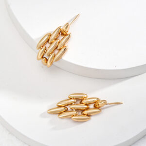 Geometric gold earrings with sculpted bloom design and radiant vintage finish, be the gliding grace.