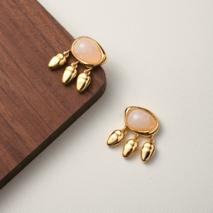 Earrings with golden drops and soft oval stone in sculpted vintage gold setting. Be the Gliding Grace.