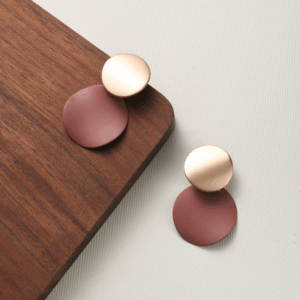 Gold and matte brown dual-circle minimalist earrings for calm styling. Be the Gliding Grace.
