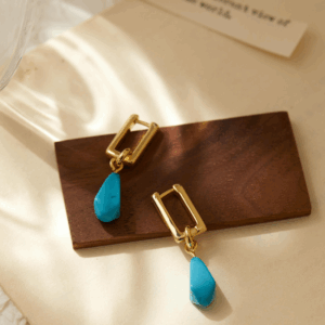 Gold thread earrings with turquoise stones, sculptural and ocean-inspired. Be the Gliding Grace.